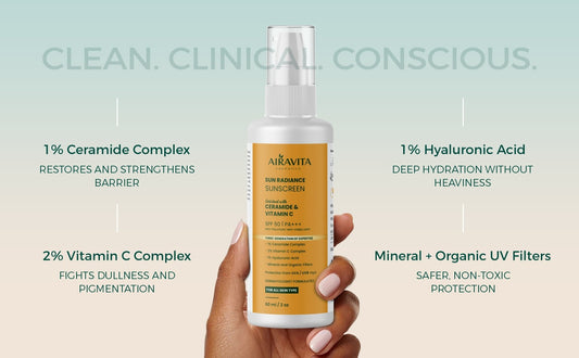 Alkavita sunscreen bottle held by a hand with product features listed on a light blue background